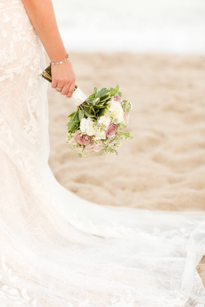 Bride holding bridal bouquet out