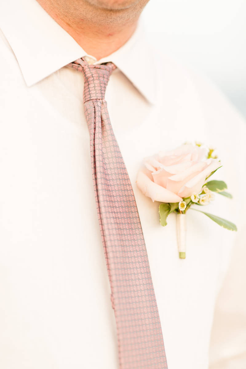 up close image of pastel pink boutonniere