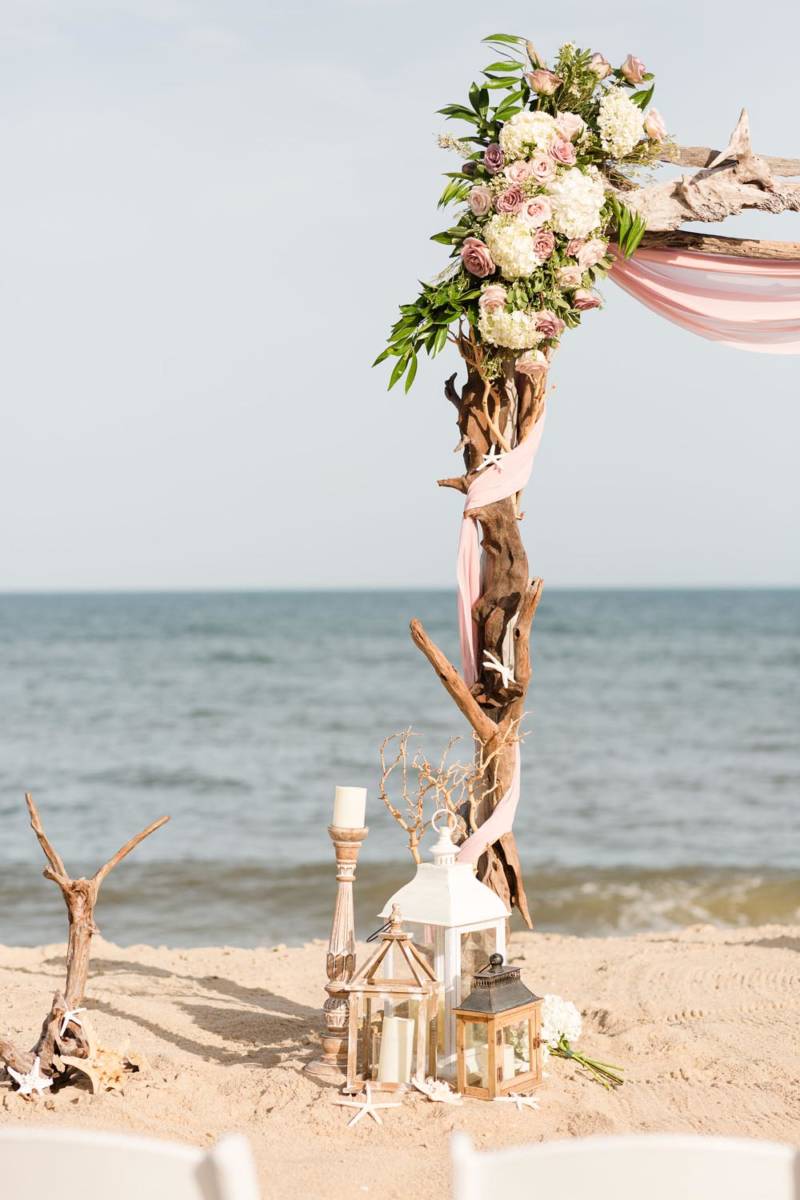 Outer Banks Wedding Arch with Florals and lantern decor